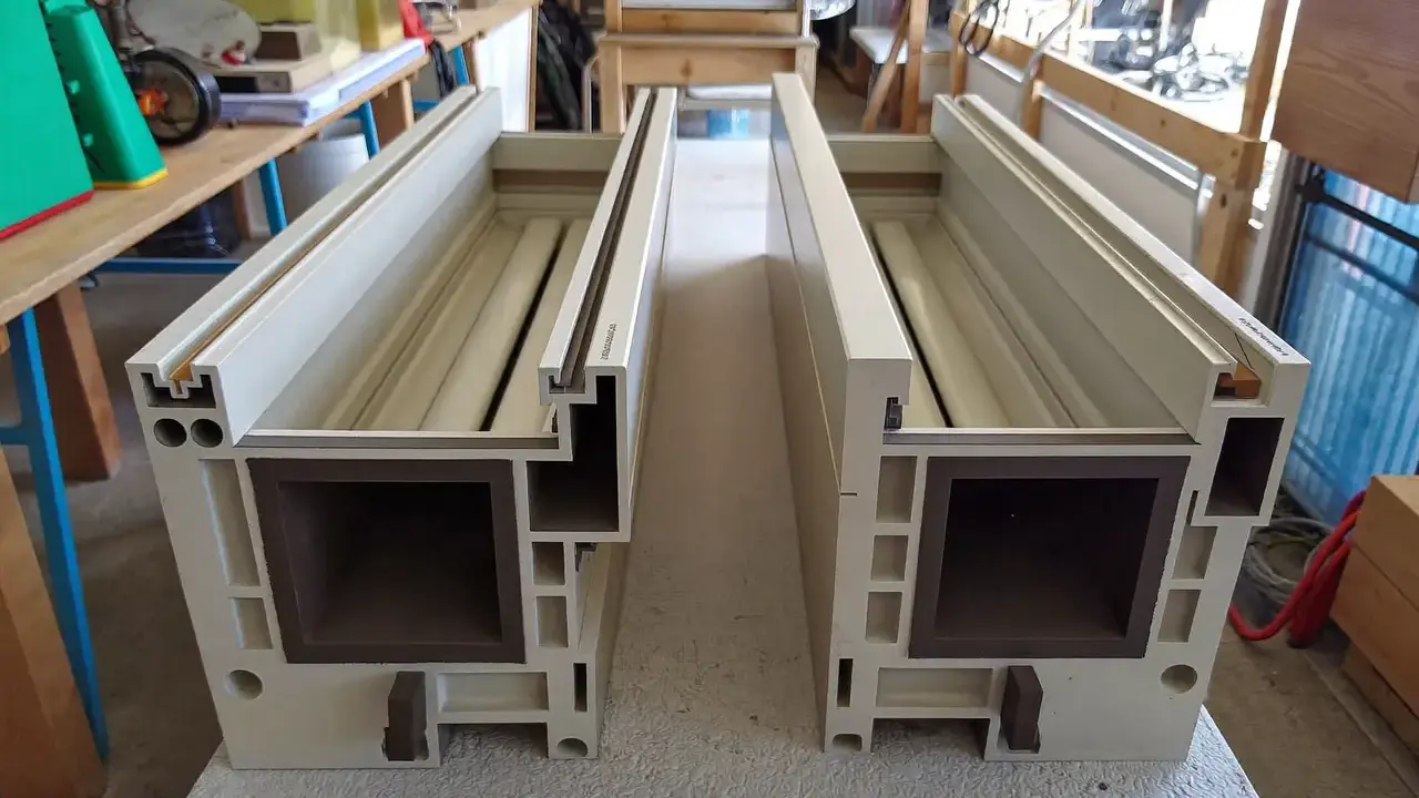 Two uPVC window profiles placed side by side to compare chambers and depth