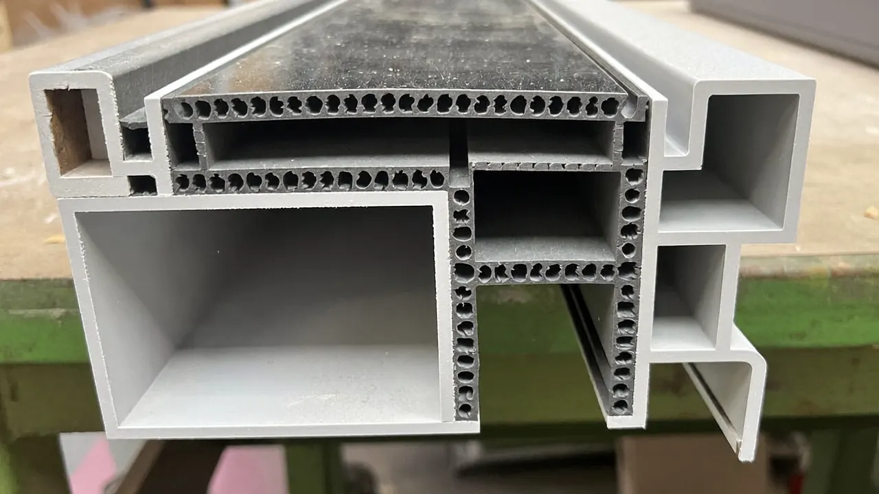 Cross-section of a multi-chamber uPVC window profile with steel reinforcement